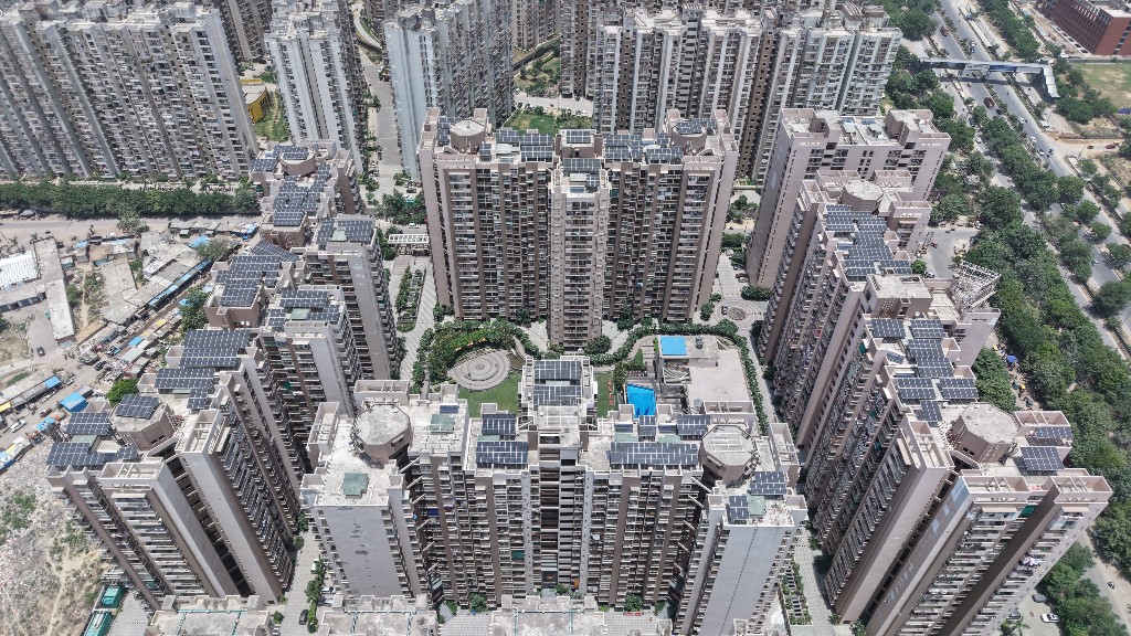 Aerial view of solar panels installed on Arihant Arden rooftops